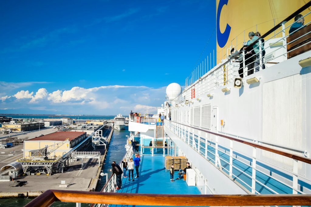 Cruise ship with people walking on the deck, a floating city whose crew must stay connected