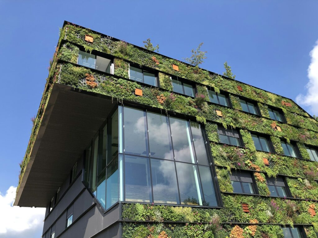 College campus building with plants growing inside and outside, a green approach to architecture