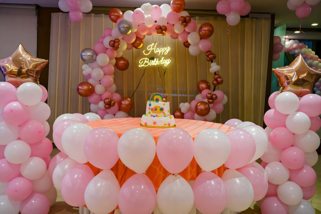 A birthday celebration decorated with balloons, setting the scene for a child's party